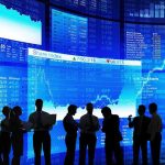 Chip Wars Heat Up: Massive AI Deal Revealed Silhouetted business professionals in front of digital stock market displays