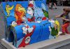 Lost Dr. Seuss Text Found – STUNNING Discovery JUST IN TIME! A colorful bench featuring Dr. Seuss characters with a child playing nearby