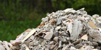 A large pile of construction debris consisting of broken concrete and other materials