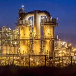 Chevron Refinery EXPLOSION: Residents Terrified! An industrial facility with illuminated structures at night