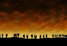 Sudden Snowstorm Traps 20 Hikers – Rescue Drama! Silhouetted figures walking against a sunset backdrop