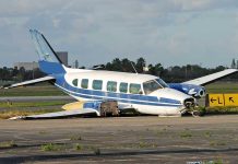 Unbelievable — Plane Drops Into Soccer Game! Damaged blue and white small airplane on an airport runway