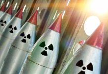 Nuclear Test Cover-Up? — Trump’s Staggering Accusation Line of nuclear missiles with radiation hazard signs.