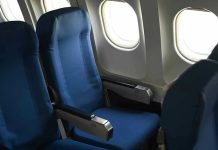 Cramped Seats: Airlines’ Hidden Profit Machine Empty airplane seats next to windows.