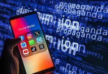 Smartphone showing social media apps with text background.