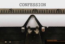 Typewriter typing the word confession on paper