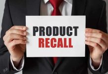 Botulism Scare! FDA Sounds Alarm on Sauces Product Recall sign held by person in suit.