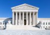 Liberal Panic Implodes—Supreme Court Stays Silent The Supreme Court building featuring marble columns and a clear blue sky