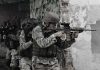 Military Readiness Shock: Urban Warfare Shortcomings Soldiers in tactical gear advancing through a damaged building