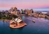 Australia’s Robot Defies Nature’s Fury Sydney Opera House and city skyline at sunset.