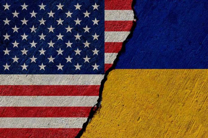 1935981547 Torn United States and Ukraine flags.
