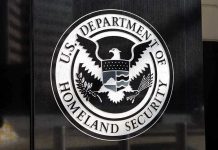 1,153% Attack Spike Rocks Federal Agents U.S. Department of Homeland Security emblem on wall.