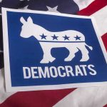 Liberal Surge Threatens GOP Stronghold Democrats logo on American flag background