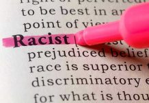 Racist highlighted in pink marker in a book.