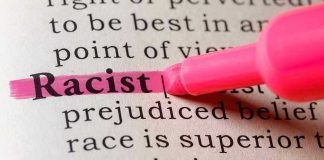 Racist highlighted in pink marker in a book.