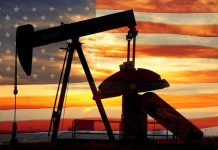 Why War with Venezuela is INEVITABLE Silhouette of an oil pump jack against a sunset background with an American flag overlay