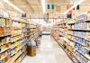 A grocery store aisle filled with various food products on shelves