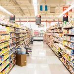 A grocery store aisle filled with various food products on shelves