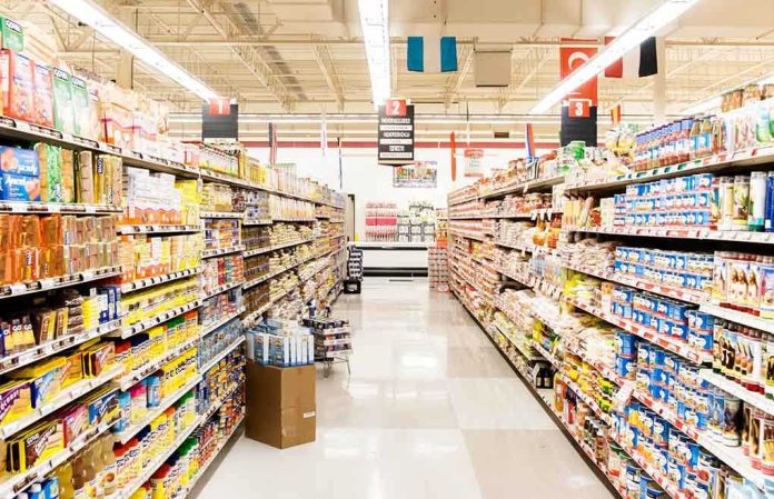 shutterstock_150161552.jpg A grocery store aisle filled with various food products on shelves