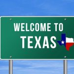 Welcome to Texas road sign with a Texas map