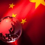 $3B Chinese School Takeover EXPOSED A globe illuminated against the backdrop of the Chinese flag