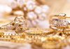 Diamond District Hidden System EXPOSED! Close-up of various gold rings adorned with sparkling gems