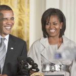 Obama Secretly OPPOSED Harris Nomination Former President Barack Obama and Michelle Obama smiling at a public event