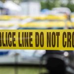 Activist’s CPS Weapon EXPLODES in Her Face Yellow police line tape with Do Not Cross.