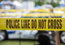 Activist’s CPS Weapon EXPLODES in Her Face Yellow police line tape with Do Not Cross.