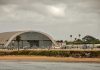 Cuba’s Alleged Drone Threat: Fact or Fiction? Aircraft hangar with helicopters near the beach.