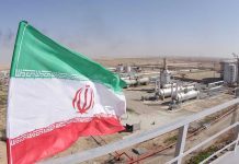 Iran’s Drone Comeback: Faster Than Anyone Expected Iranian flag near an industrial gas refinery.