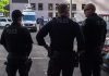 Trump’s “Liberation” Triggers D.C. Meltdown Three police officers standing on a city street.