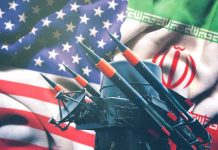 Revolutionary Iran Defies U.S. Sanctions Iran and USA flags with missile launcher.