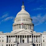 TRUMP VOWS: Cuba Will Fall Soon! US Capitol Building against blue sky.