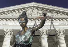 JUSTICE PROBE: Fairfax Prosecutor Caught in Crossfire Lady Justice statue in front of courthouse.