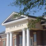 California Mayor’s Shocking Chinese Spy Allegations Exterior view of a city hall building with columns and a clear blue sky