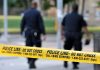 Rape and Strangulation ROCK UCSB Campus Police officers walking past caution tape at a crime scene