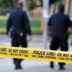 Rape and Strangulation ROCK UCSB Campus Police officers walking past caution tape at a crime scene