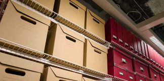 Trump’s Law-and-Order Strategy: Iran As the New Enemy Shelves filled with brown and red storage boxes for organizing documents