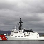 11 Survive Harrowing Ocean Ditch A U.S. Coast Guard ship docked under cloudy skies