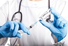 Moral Collision: Abortion’s Unsolvable Dilemma Doctor filling syringe with vaccine from vial.