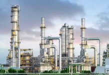 Drone Blitz Cripples Moscow’s Fuel Lifeline Industrial plant with metal towers and pipes.