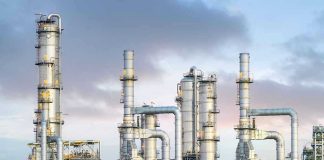 Drone Blitz Cripples Moscow’s Fuel Lifeline Industrial plant with metal towers and pipes.