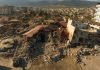 Iran School Blast Has U.S. Fingerprints All Over It Cityscape with collapsed buildings and rubble after earthquake