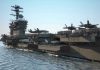 Aircraft carrier deck with jet planes.