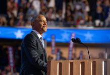 Obama Center Becomes Trump Battlefield A speaker at a podium addressing an audience during a political event