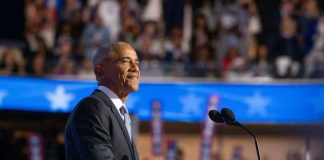 Obama Center Becomes Trump Battlefield A speaker at a podium addressing an audience during a political event
