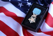 Trump Revives Forgotten Hero A military medal displayed on a black box with an American flag background