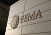 Disaster Money Flip — States on the Hook FEMA building sign with Homeland Security emblem