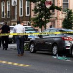Outrage In NYC: Child Beaten, Motive Debated Police and crime scene tape on city street.